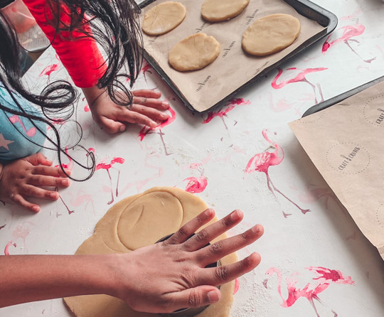 Cutting circles out of dough with cutter